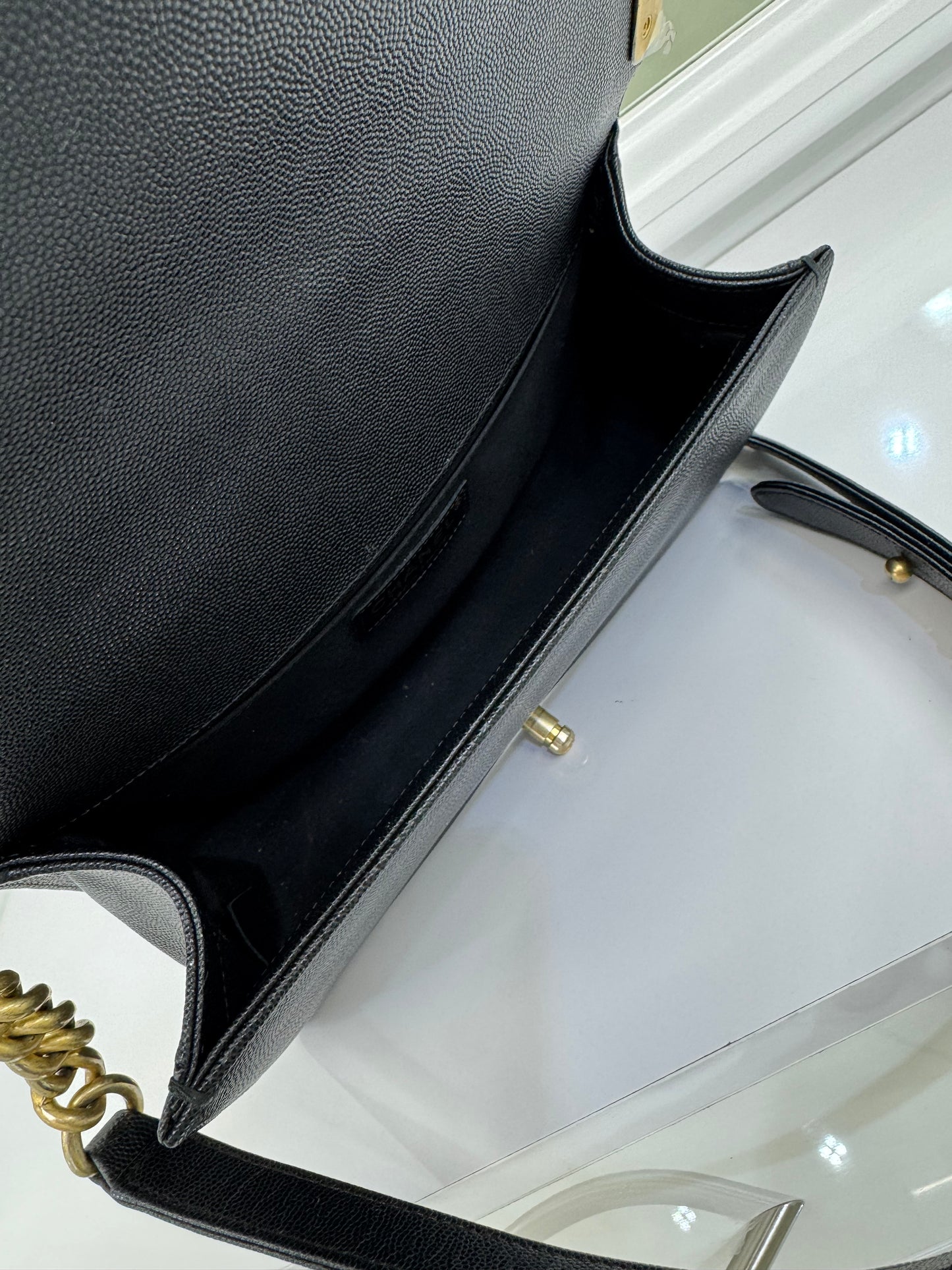 Authentic Chanel Boy Bag in Black Caviar Leather with Aged Gold Hardware