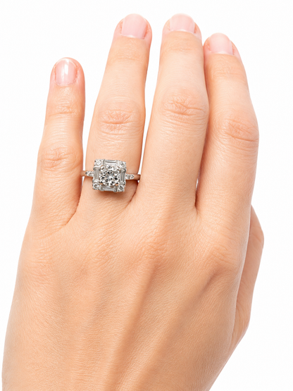 Vintage Platinum Round Brilliant Diamond Ring with Baguette Accents