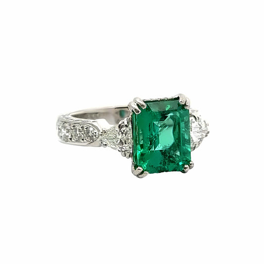 Platinum Three-Stone Emerald and Diamond Ring