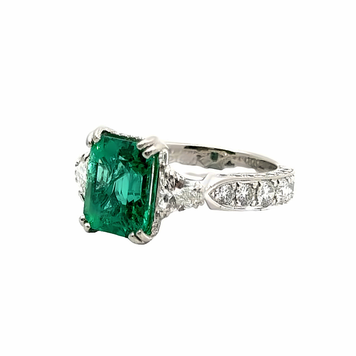 Platinum Three-Stone Emerald and Diamond Ring