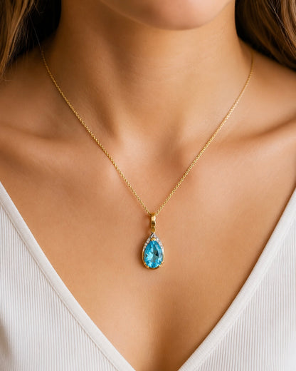14K Gold Blue Topaz Pear Pendant with Diamond Accents Enhancer