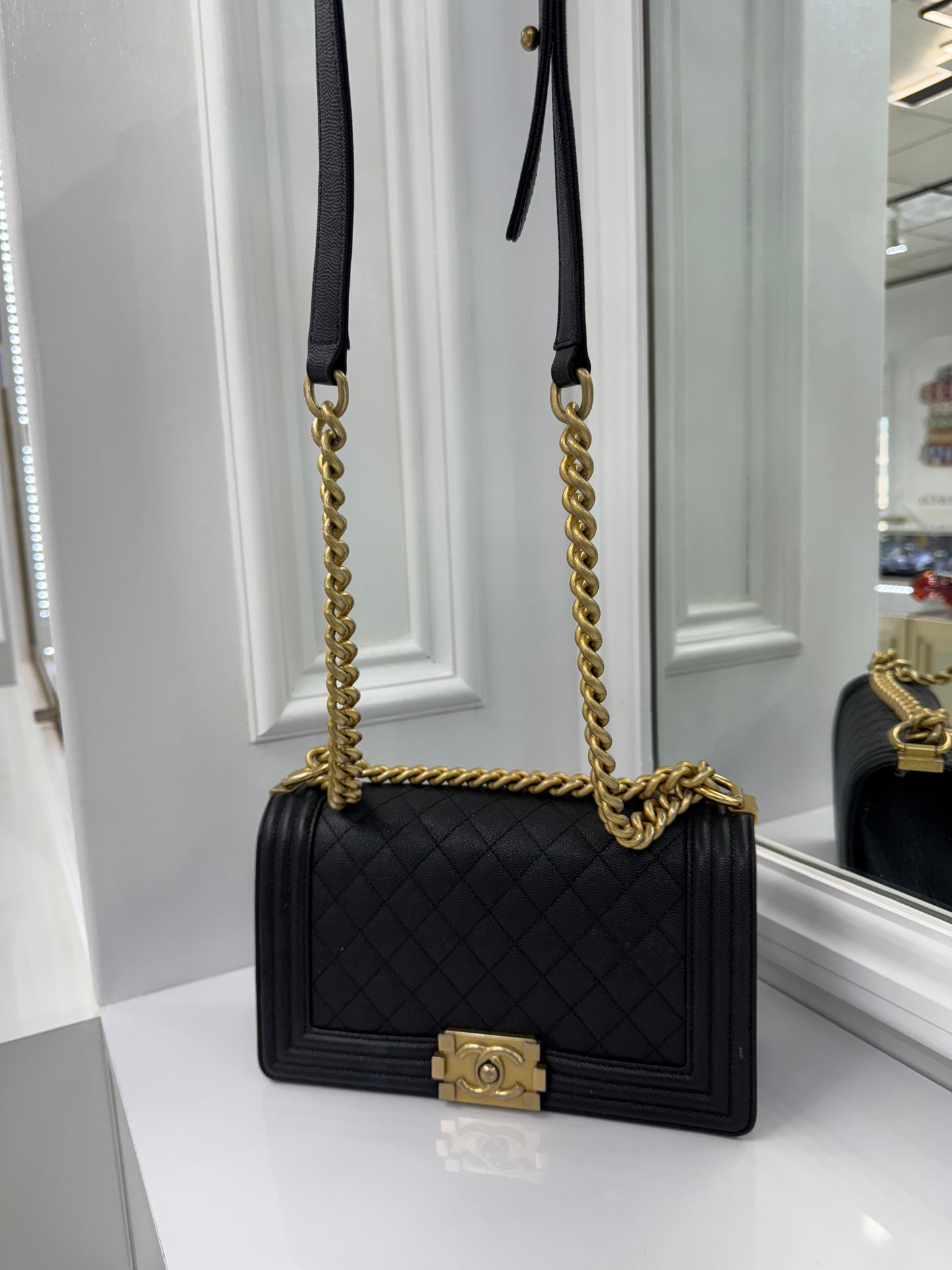 Authentic Chanel Boy Bag in Black Caviar Leather with Aged Gold Hardware