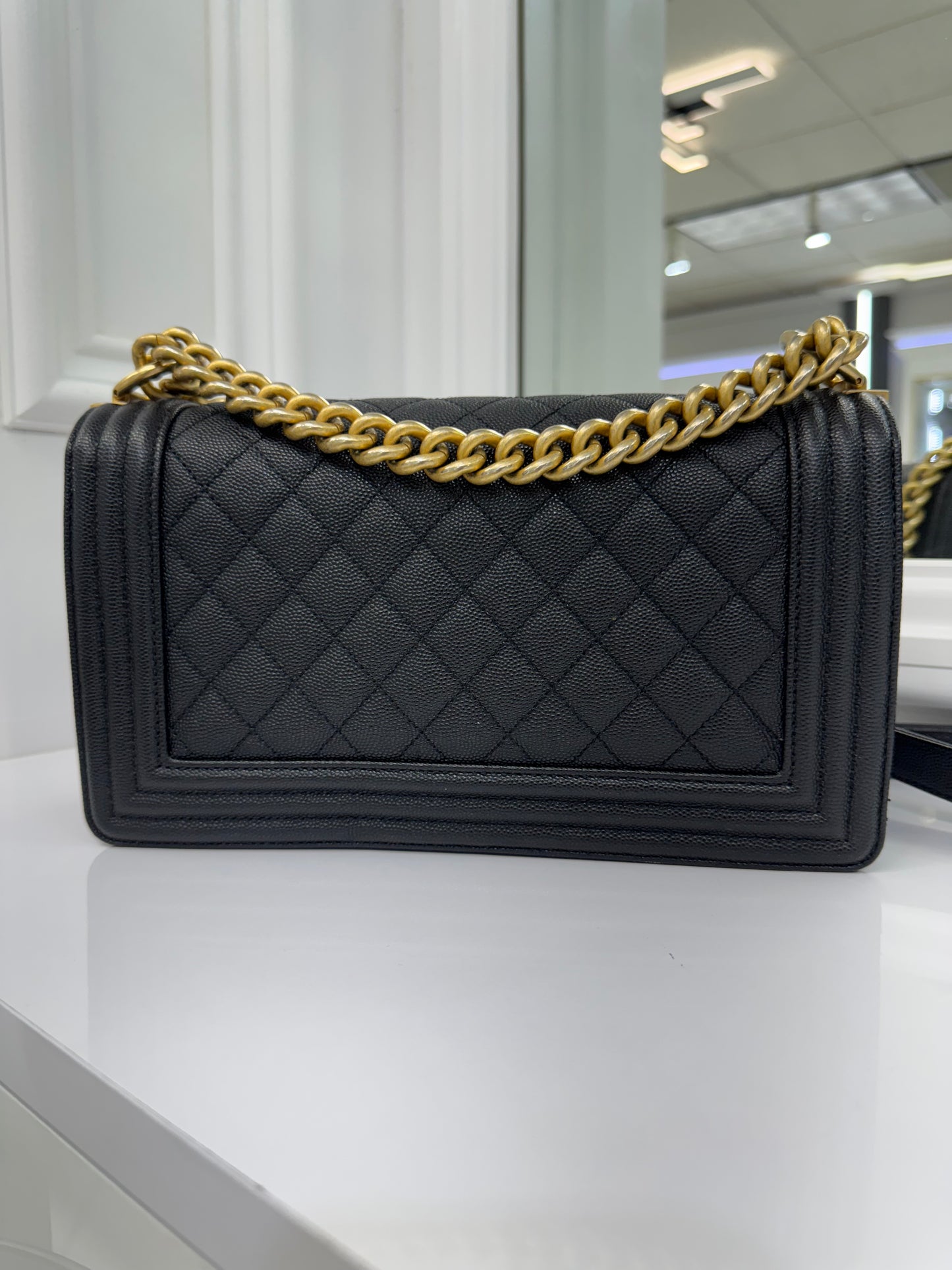 Authentic Chanel Boy Bag in Black Caviar Leather with Aged Gold Hardware