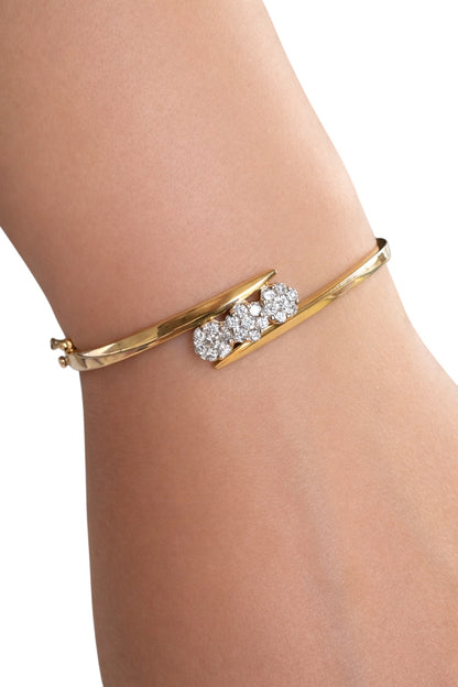 Classic 14K Yellow Gold Diamond Bangle with Triple Flower Design
