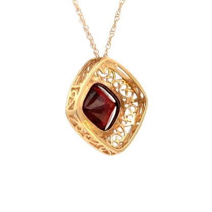 14K Yellow Gold Garnet Cushion Cut Pendant with Gold Filigree Frame