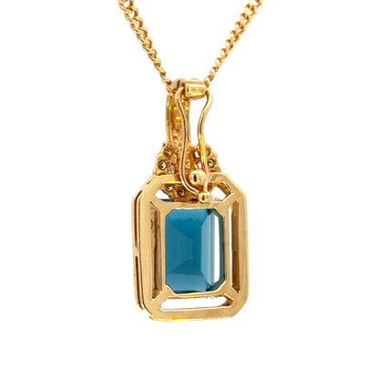 14K Yellow Gold Emerald Cut Blue Topaz & Diamond Enhancer Pendant