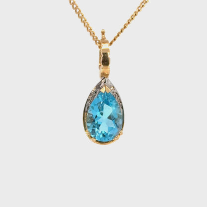 14K Gold Blue Topaz Pear Pendant with Diamond Accents Enhancer
