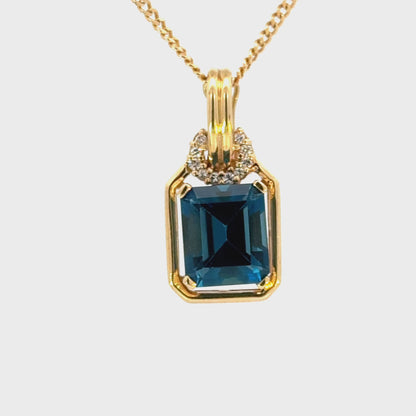 14K Yellow Gold Emerald Cut Blue Topaz & Diamond Enhancer Pendant