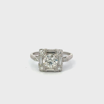 Vintage Platinum Round Brilliant Diamond Ring with Baguette Accents